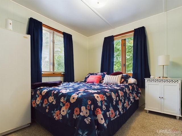 bedroom featuring light colored carpet