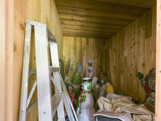 view of sauna with wood walls and wooden ceiling