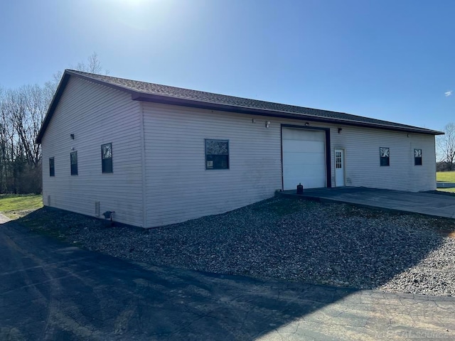 back of house with a garage