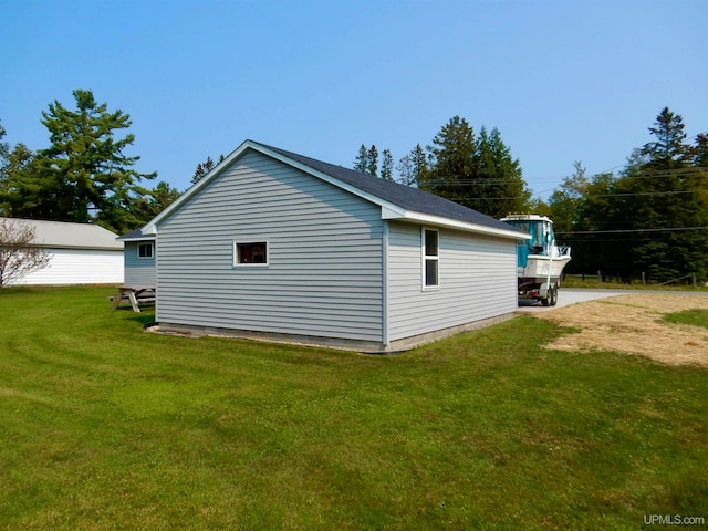 view of home's exterior featuring a patio area and a lawn