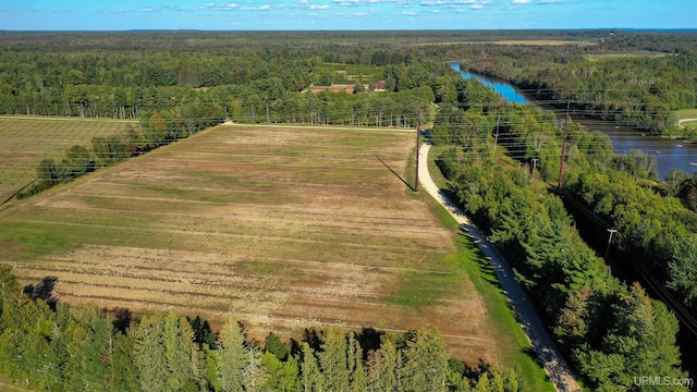 aerial view with a rural view and a water view