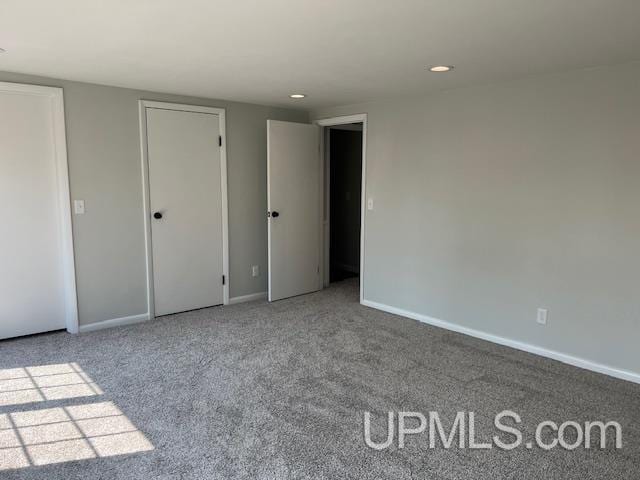 unfurnished bedroom featuring carpet