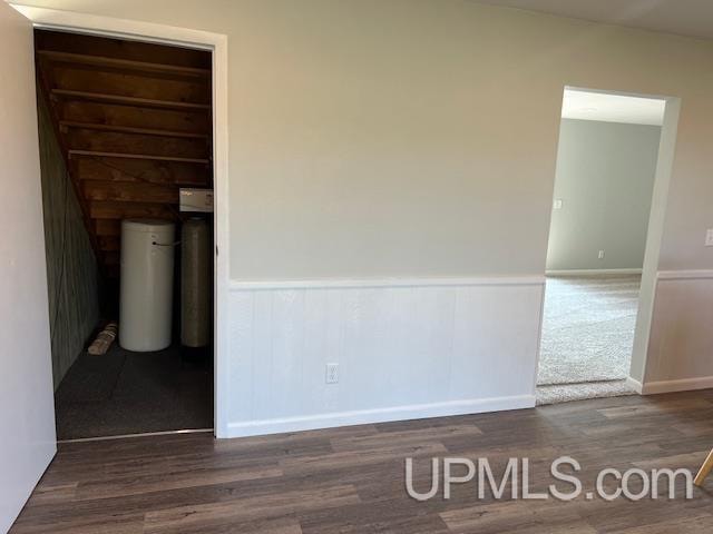 empty room with dark hardwood / wood-style floors