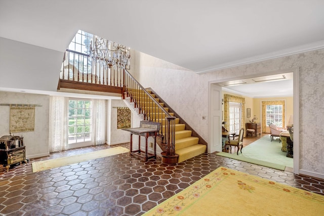 interior space with plenty of natural light and ornamental molding