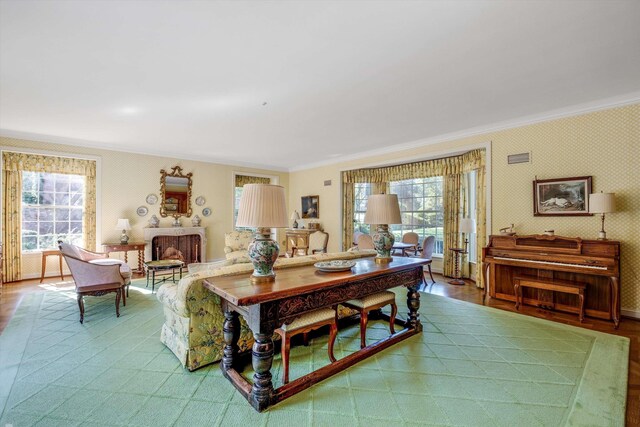 living room with crown molding and hardwood / wood-style flooring