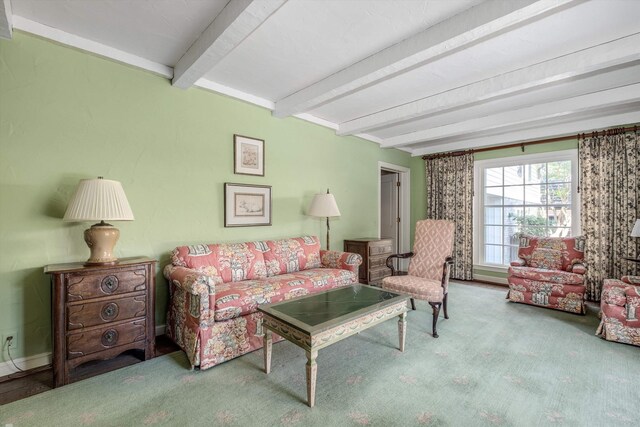 living room with carpet and beam ceiling