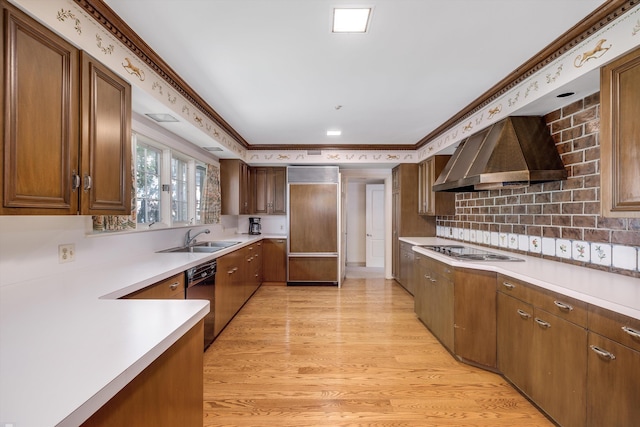 kitchen with backsplash, white gas cooktop, light hardwood / wood-style floors, wall chimney exhaust hood, and ornamental molding