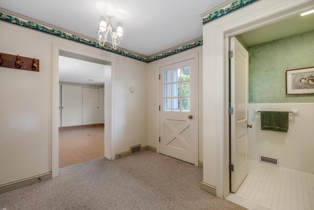 foyer with a chandelier