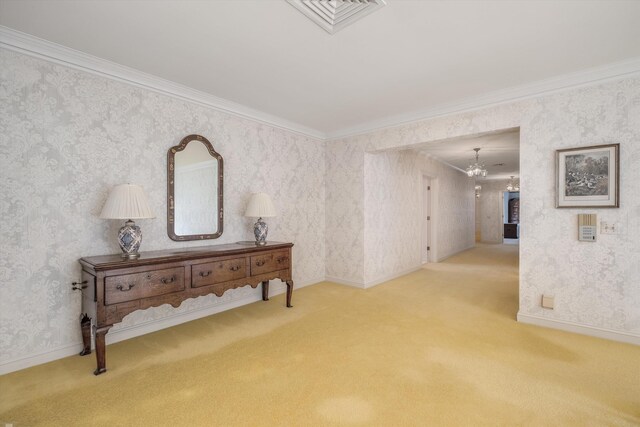 interior space with carpet, an inviting chandelier, and crown molding