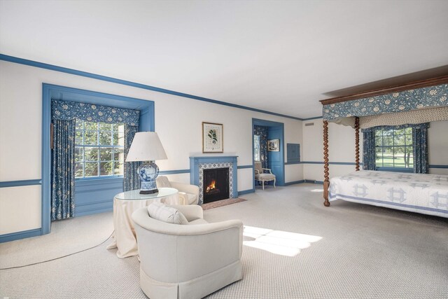 bedroom featuring ornamental molding and carpet floors