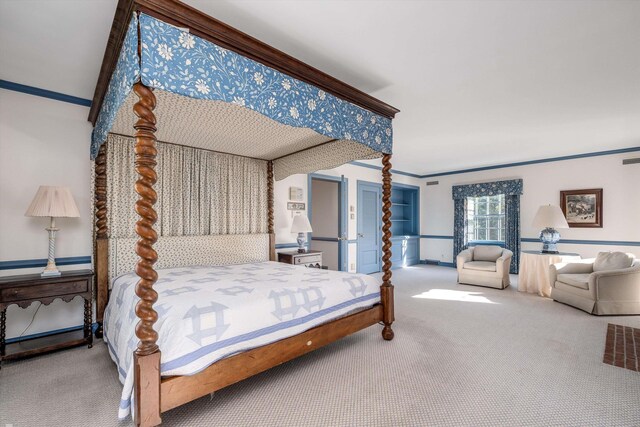 bedroom with crown molding and carpet flooring