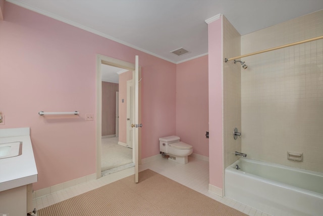 full bathroom with tile patterned floors, toilet, tiled shower / bath combo, vanity, and ornamental molding