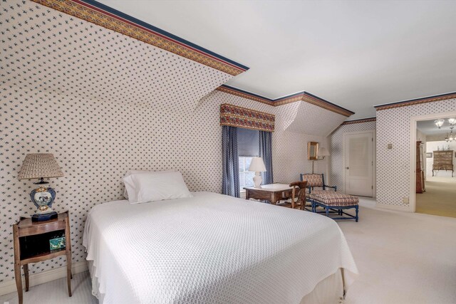 carpeted bedroom with ornamental molding