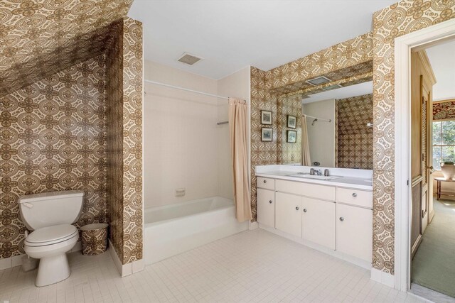 full bathroom with vanity, toilet, and shower / bath combo