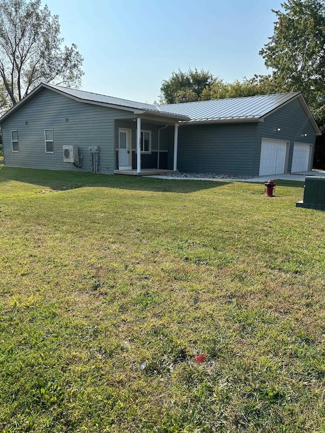 view of front of property with ac unit and a front yard