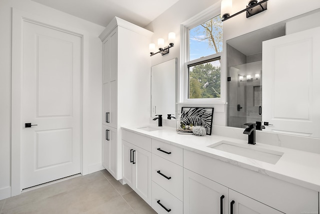 bathroom featuring tile patterned flooring, vanity, and an enclosed shower