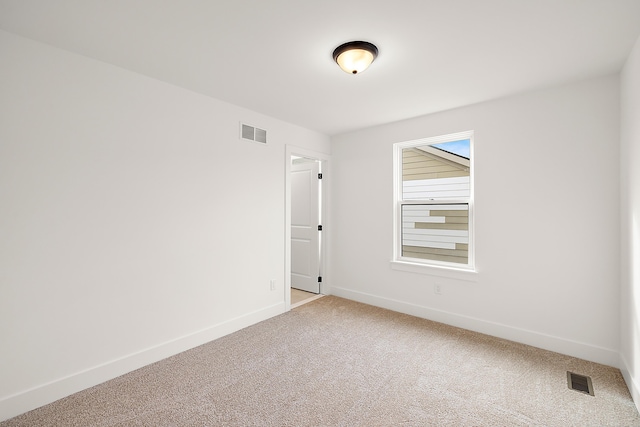 spare room featuring carpet floors