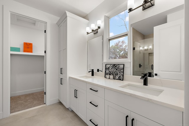 bathroom with vanity and an enclosed shower