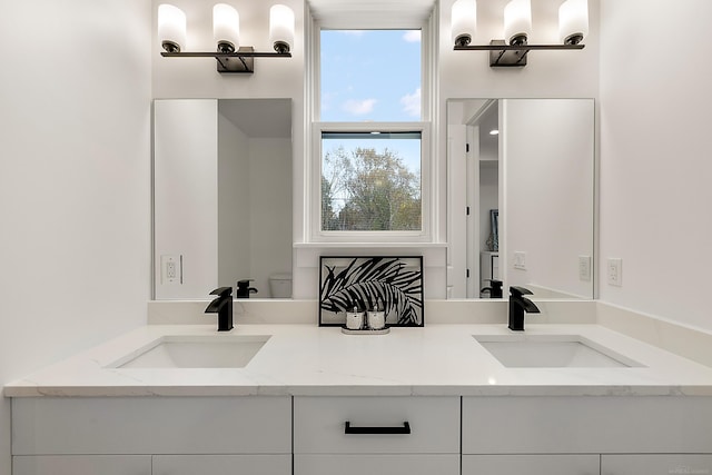 bathroom with vanity and toilet