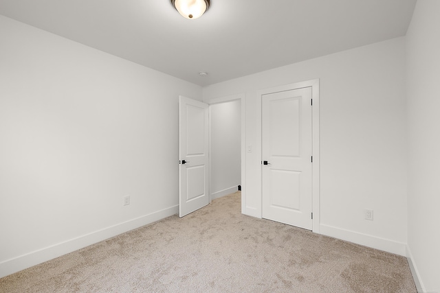 unfurnished bedroom with light carpet