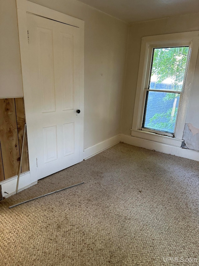 unfurnished bedroom featuring carpet flooring