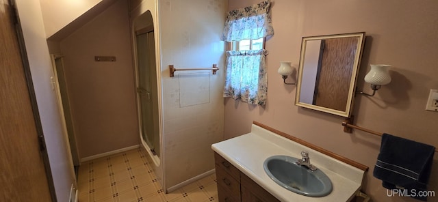 904 W A St, Iron Mountain, MI 49801 - full bath with vanity, a stall shower, tile patterned floors, and baseboards