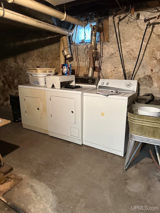 laundry area with independent washer and dryer