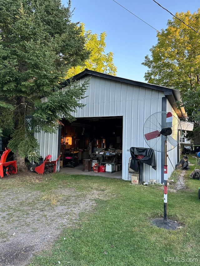 view of outbuilding with a yard