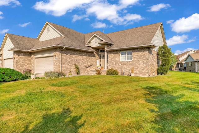 view of front of home featuring a garage and a front lawn