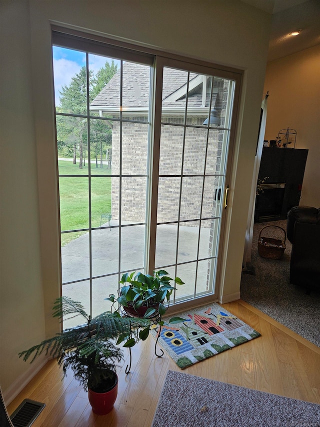 doorway to outside featuring hardwood / wood-style flooring