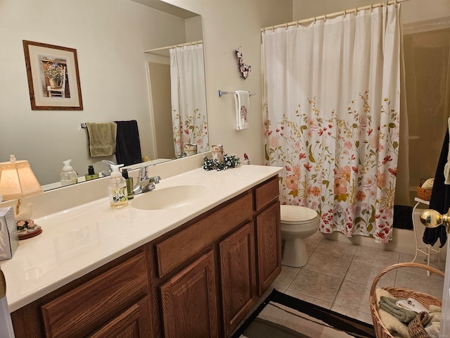 bathroom featuring a shower with shower curtain, vanity, toilet, and tile patterned floors