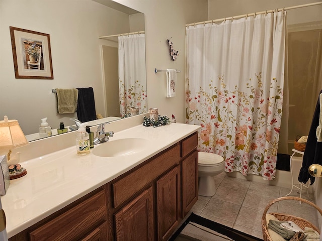 bathroom featuring a shower with shower curtain, vanity, toilet, and tile patterned floors