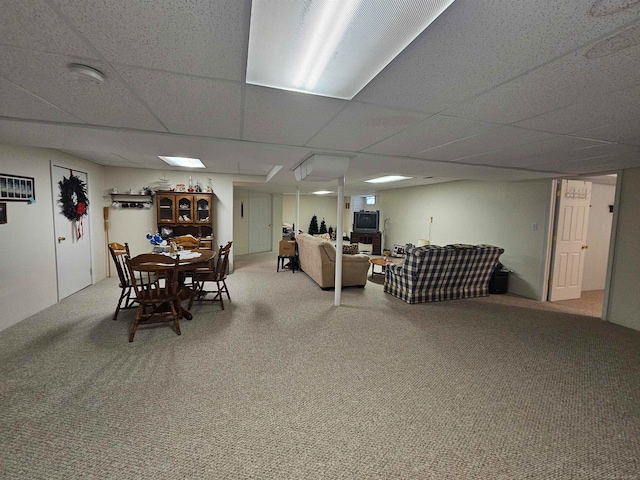 dining space with a paneled ceiling