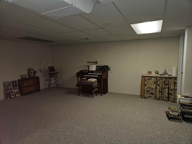 miscellaneous room with a drop ceiling and carpet flooring