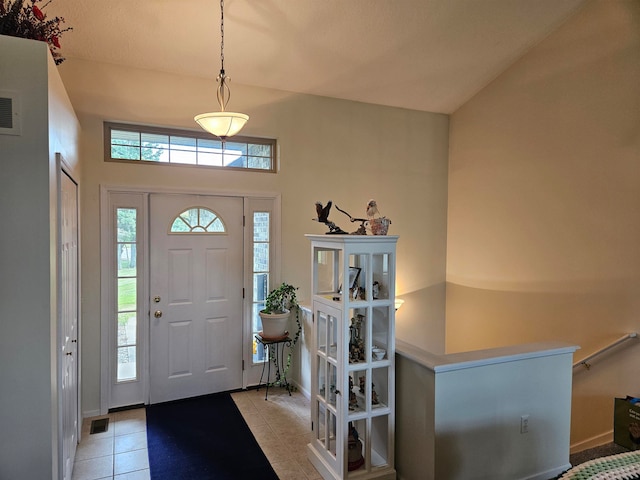 foyer featuring light tile patterned flooring