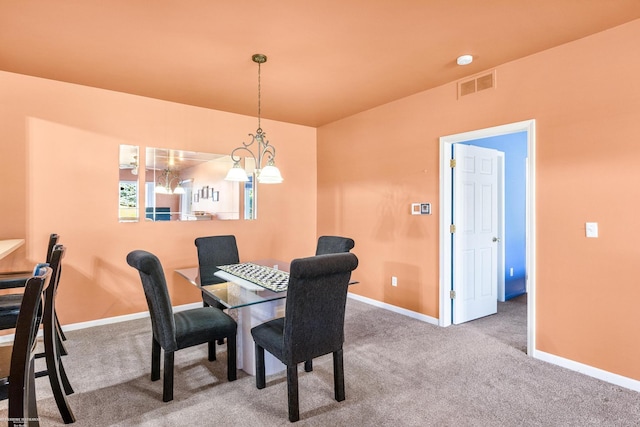 dining space featuring carpet flooring