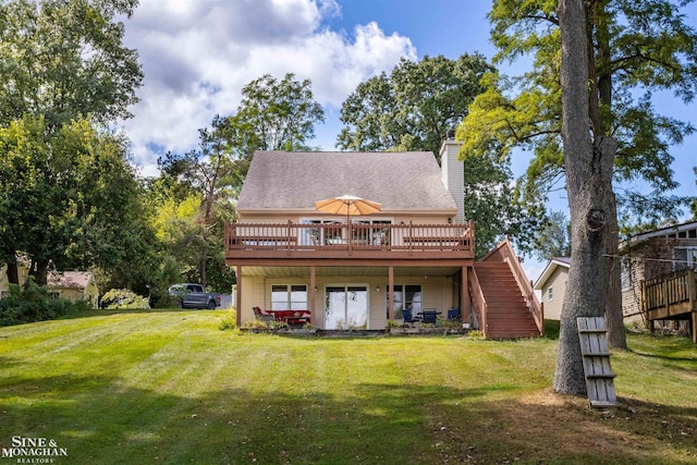 2771 Hemlock Rd, Quincy, MI 49082 - rear view of property with a deck, stairway, and a yard