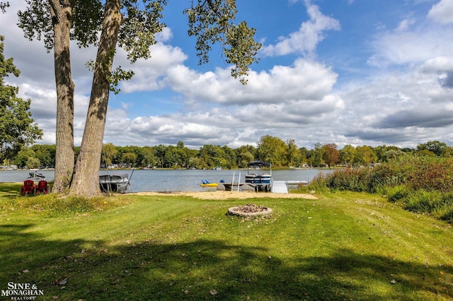 2771 Hemlock Rd, Quincy, MI 49082 - view of grassy yard with a water view and a boat dock