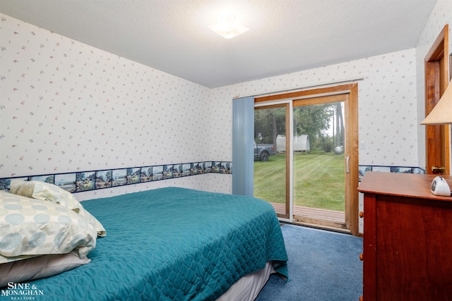 bedroom with multiple windows, a textured ceiling, access to outside, and carpet floors