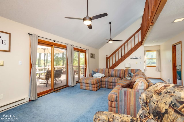 2771 Hemlock Rd, Quincy, MI 49082 - carpeted living room featuring a baseboard heating unit, a ceiling fan, vaulted ceiling, and stairs