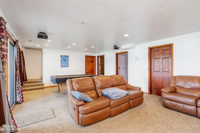 living room featuring a barn door, pool table, and carpet floors