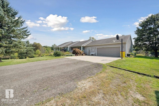 view of front of house with a garage and a front yard