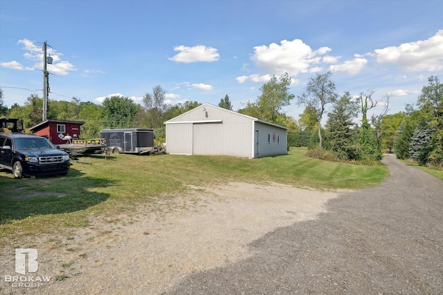 view of yard with an outbuilding and a garage