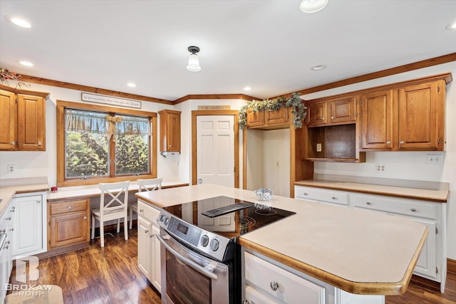 kitchen featuring electric range, a center island, dark hardwood / wood-style floors, and white cabinetry