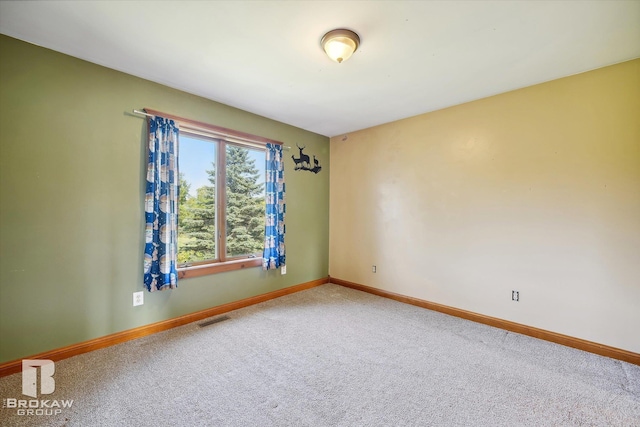 unfurnished room with carpet flooring