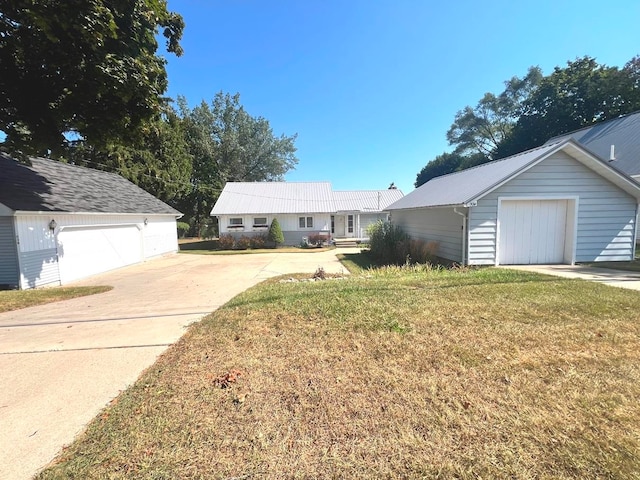 ranch-style home featuring a garage and a front yard