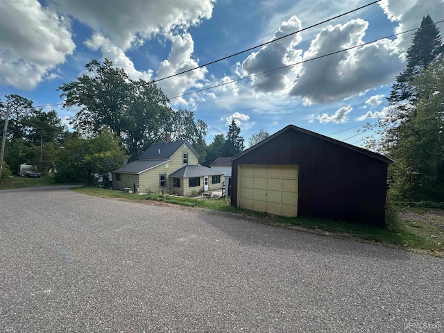 view of front of home with an outbuilding and a garage