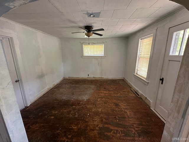 unfurnished room featuring ceiling fan and a healthy amount of sunlight