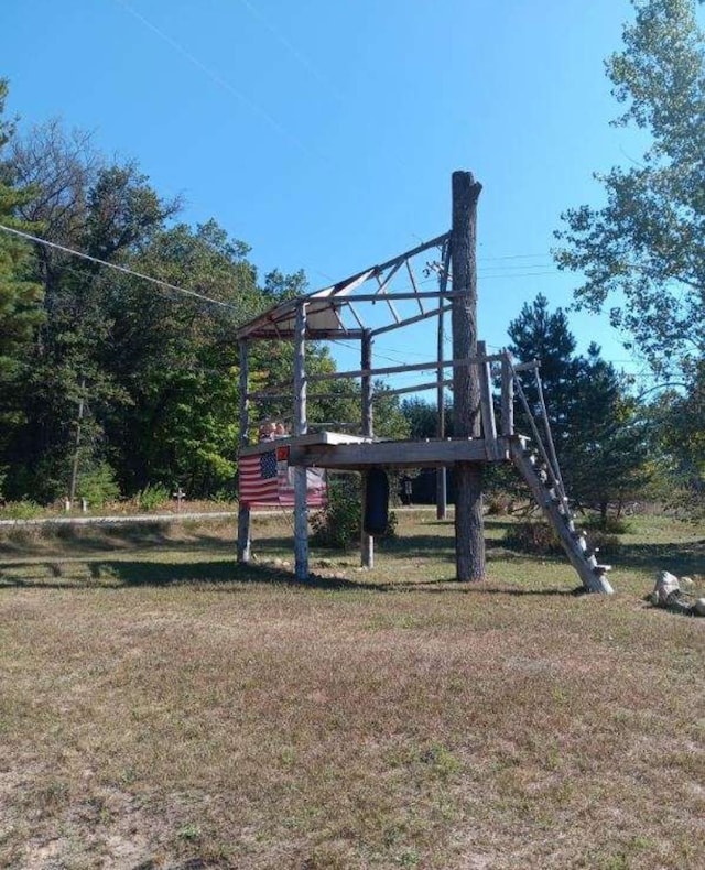 view of playground with a lawn