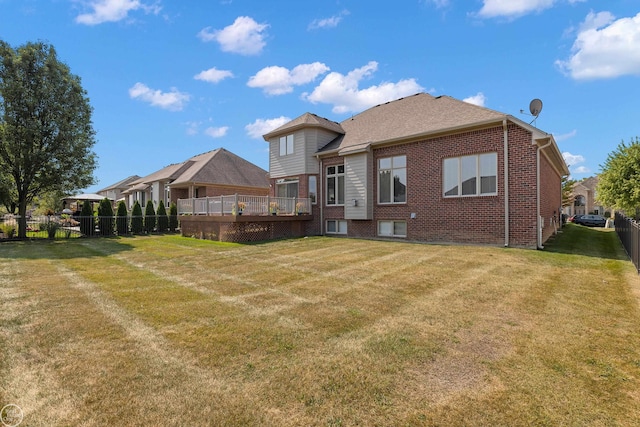 back of property featuring a yard